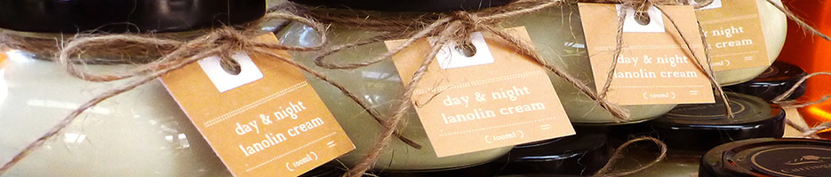 Glass jars, filled with lanolin cream.
